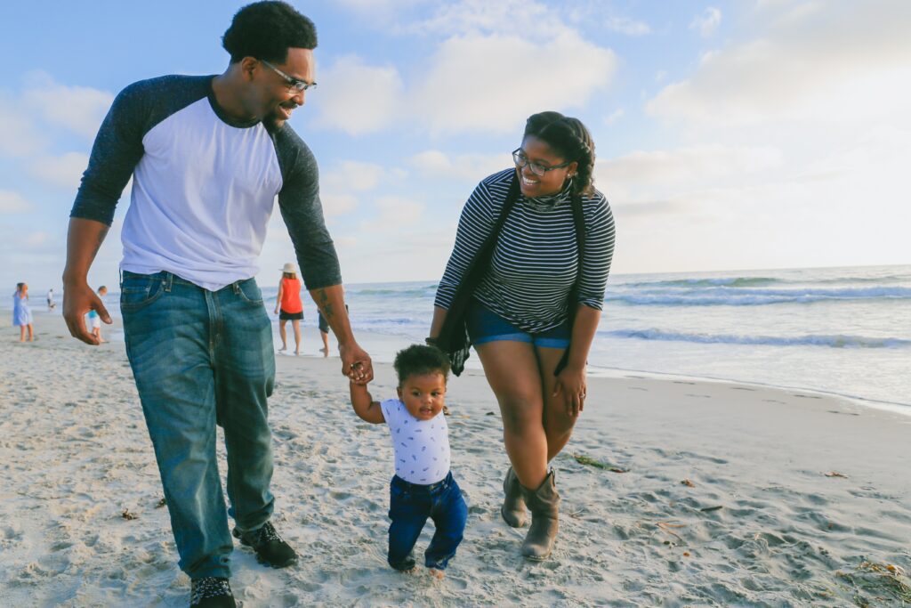 happy family walking on beach. 
