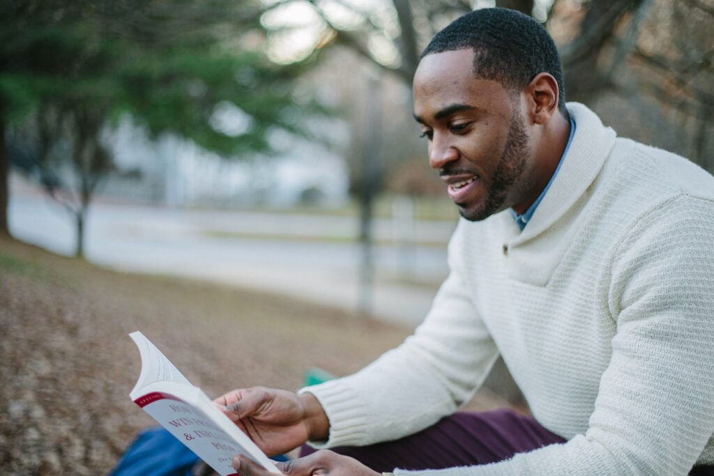 man reading a book.