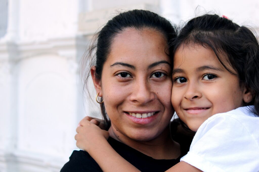 mother and daughter smiling
